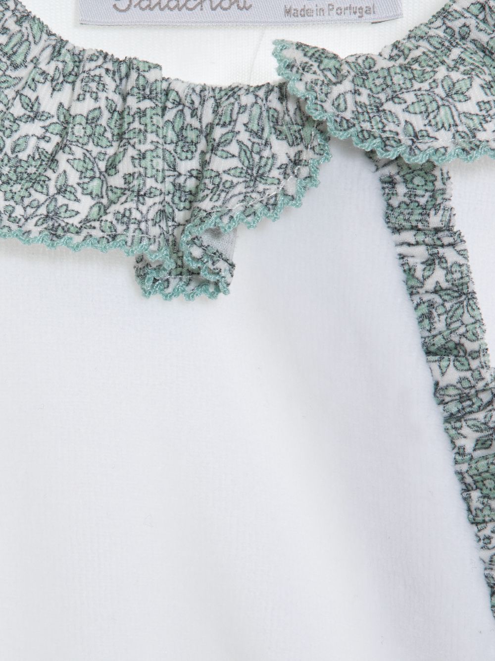 White babygrow with Liberty print frill
