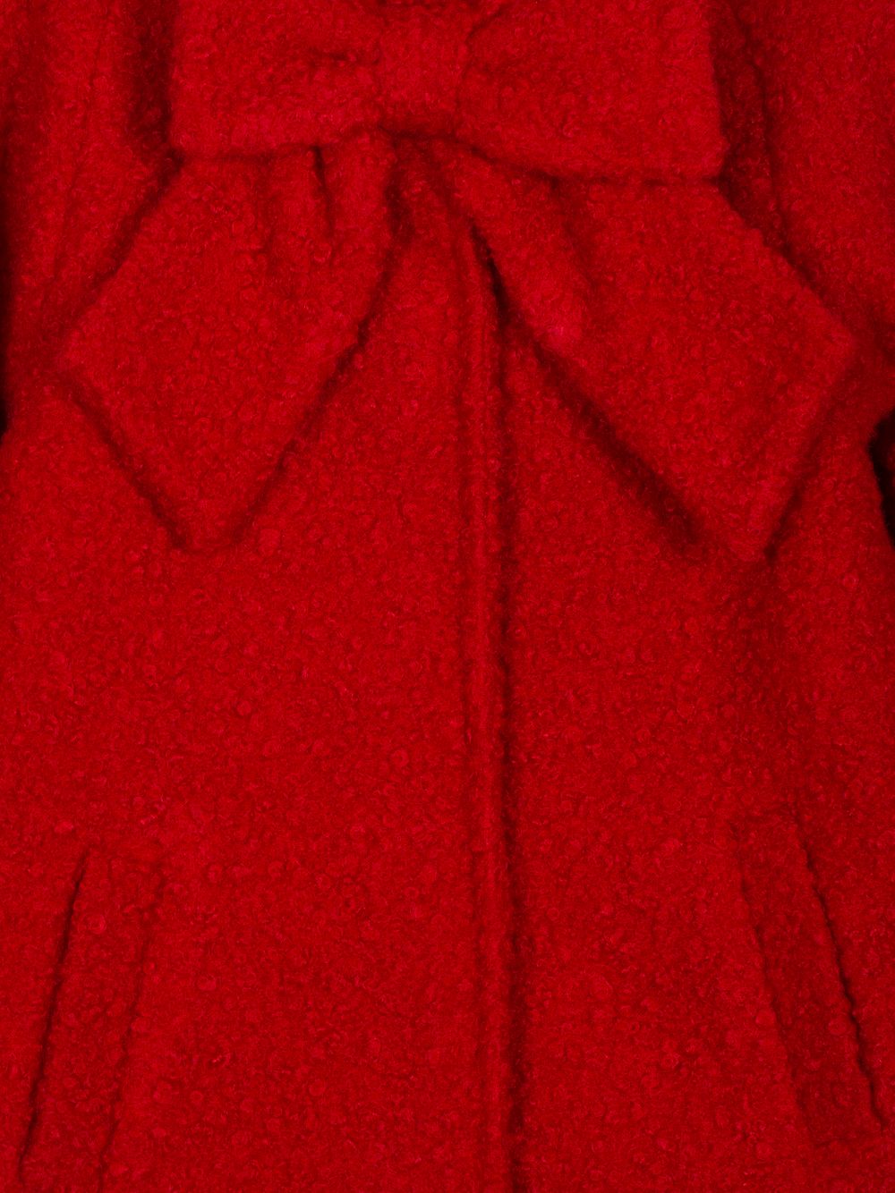 Red bouclé coat with bow