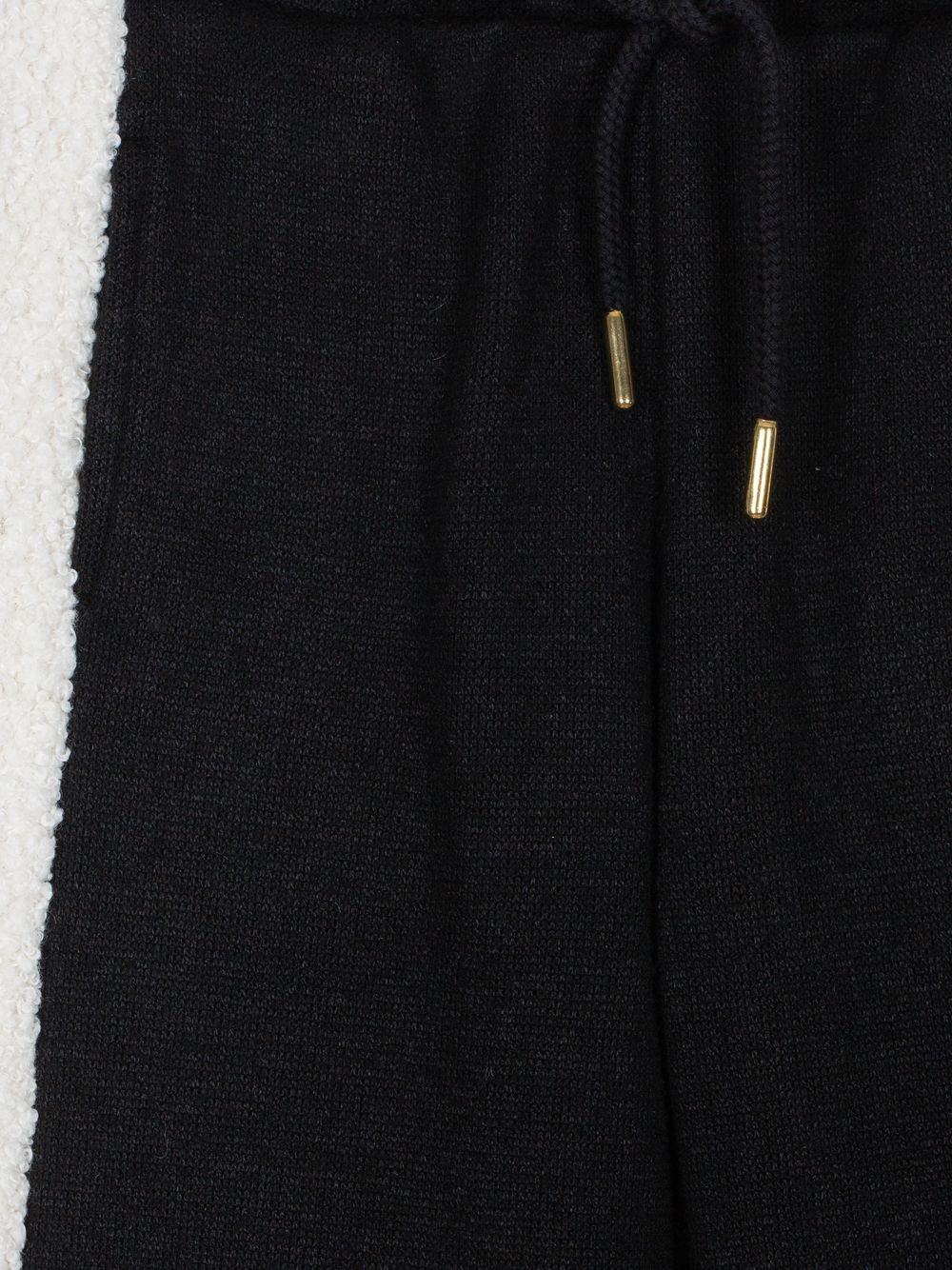 Black pants with bouclé stripes