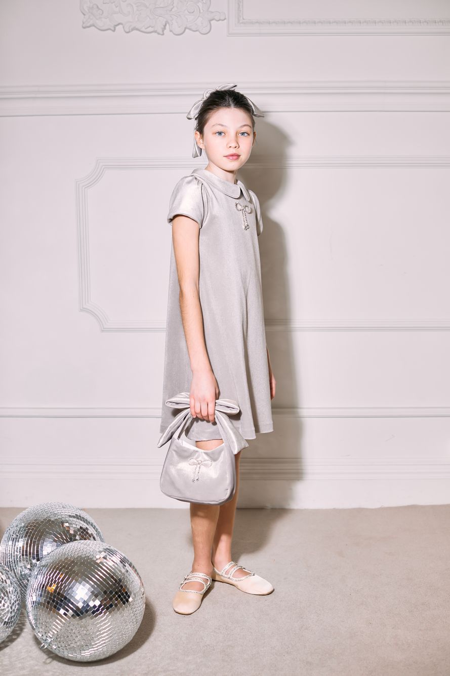 Golden velvet handbag with crystal bow