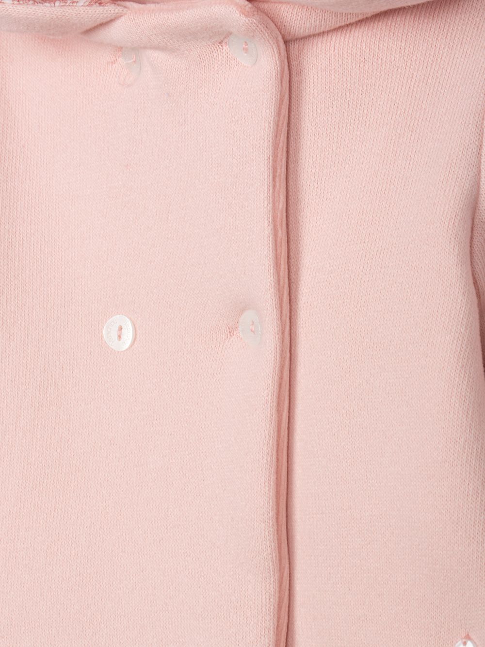 Pale pink coat with a hood lined with Liberty fabric