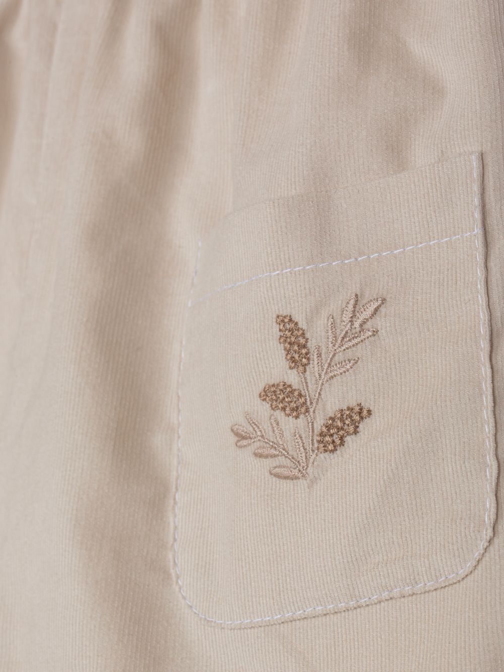 Elegant beige embroidered trousers