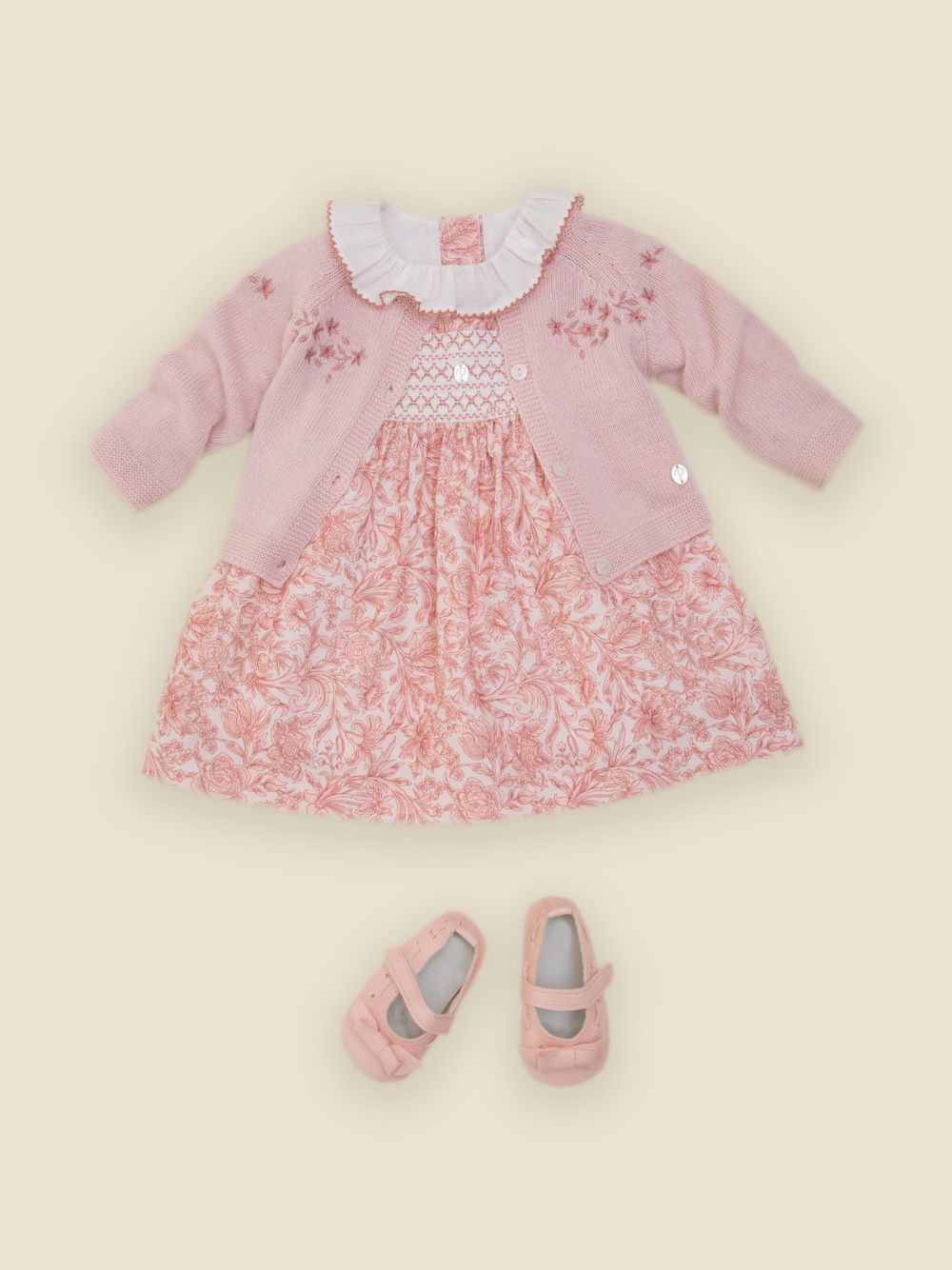 Pale pink knit cardigan with elegant embroidery