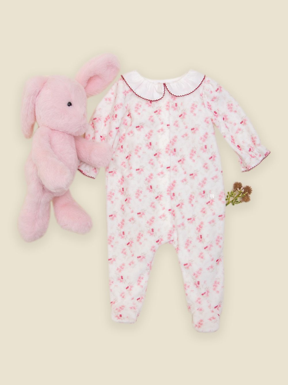 Pink babygrow with floral print