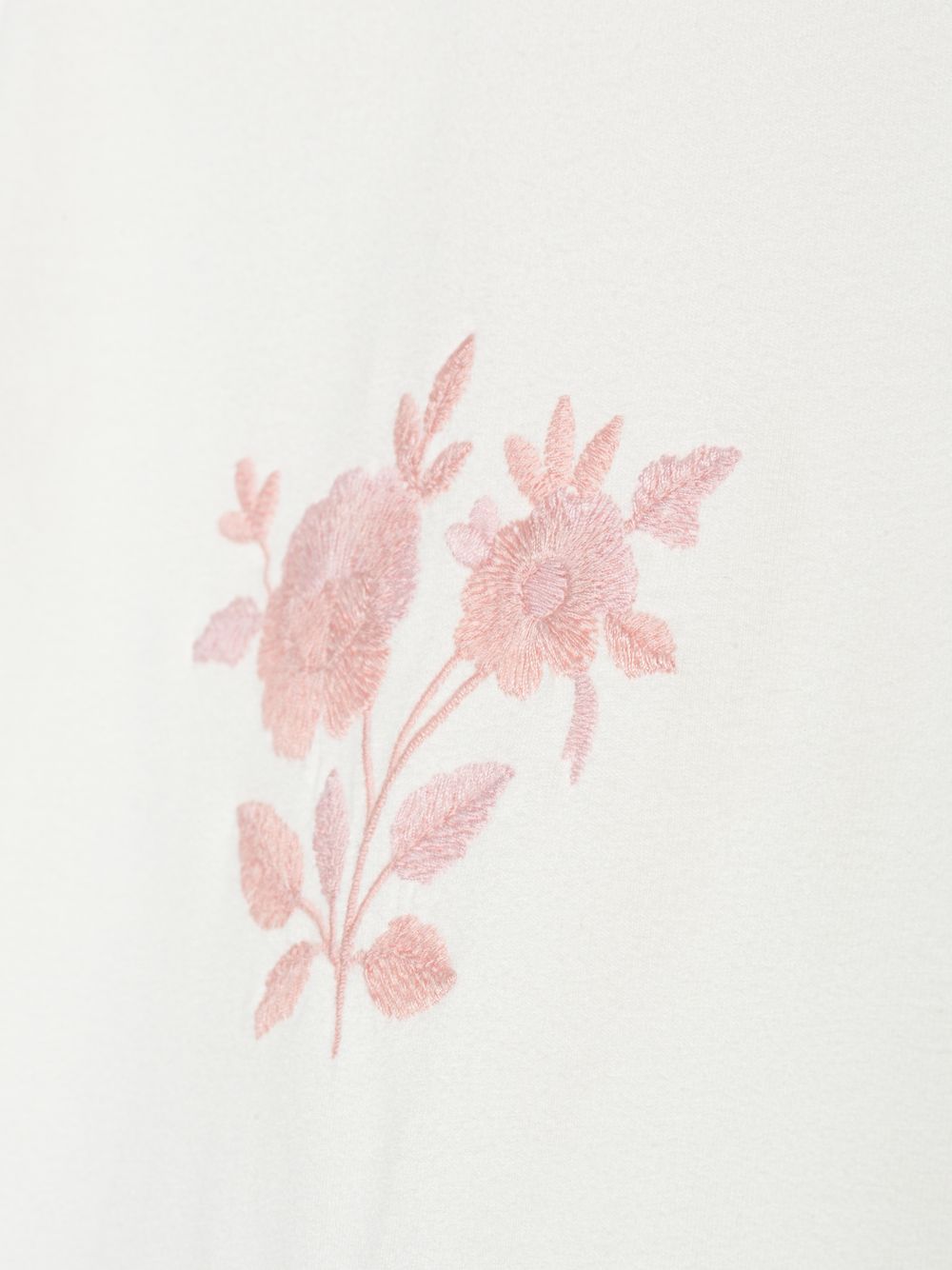 Pale pink blouse with delicate embroidery on the front