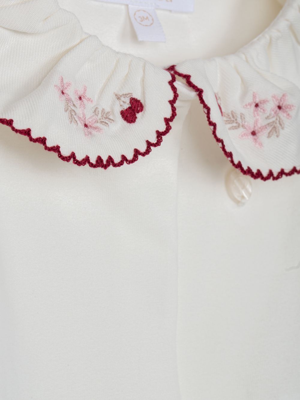 Elegant ecru bodysuit with embroidered collar
