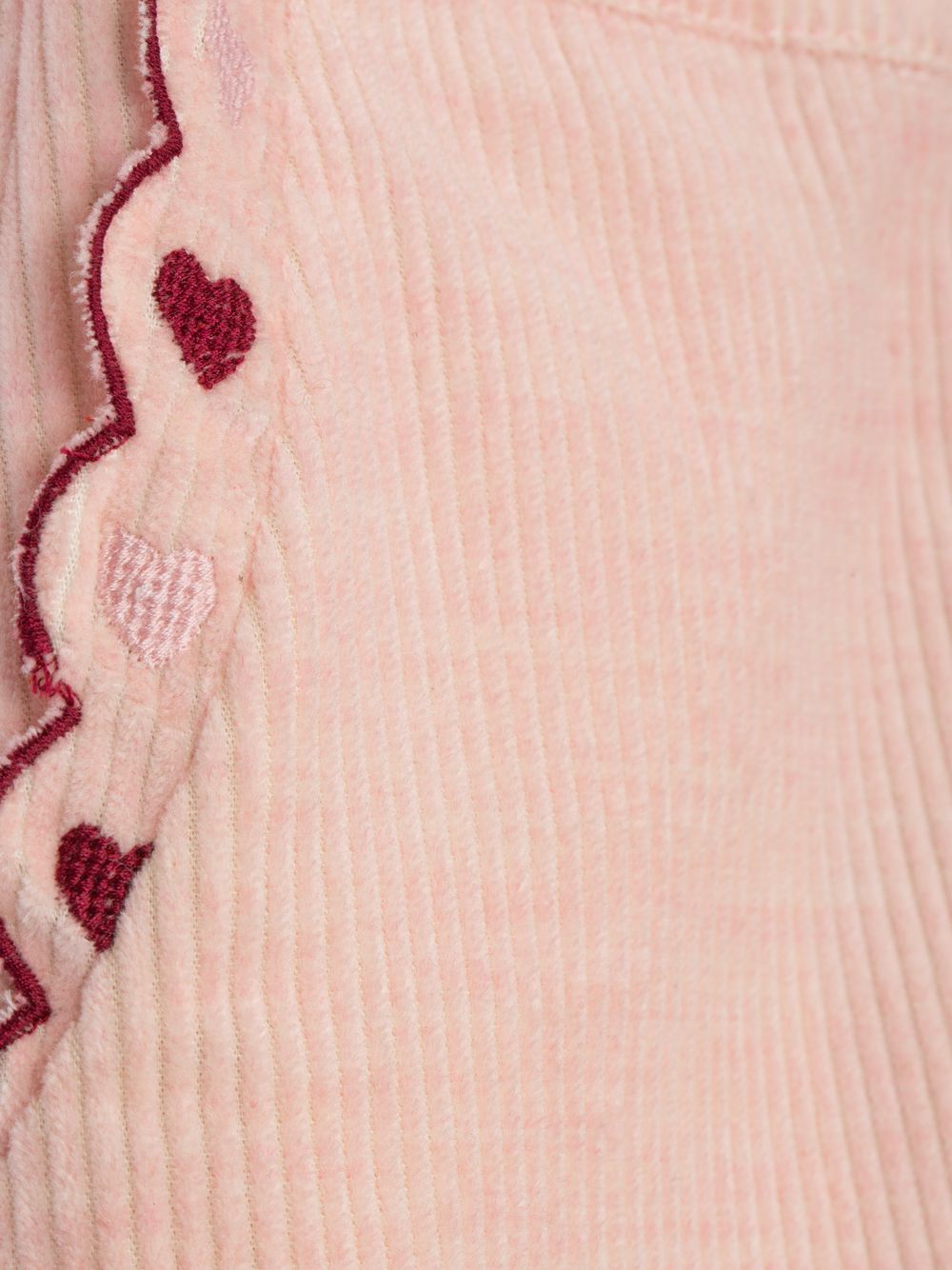 Pale pink pants with embroidery and an elegant finish