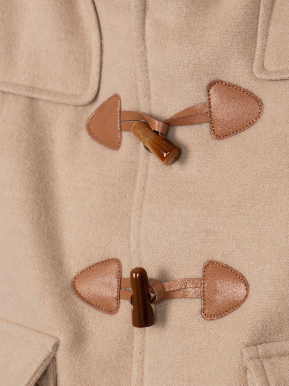 Beige coat with wooden buttons