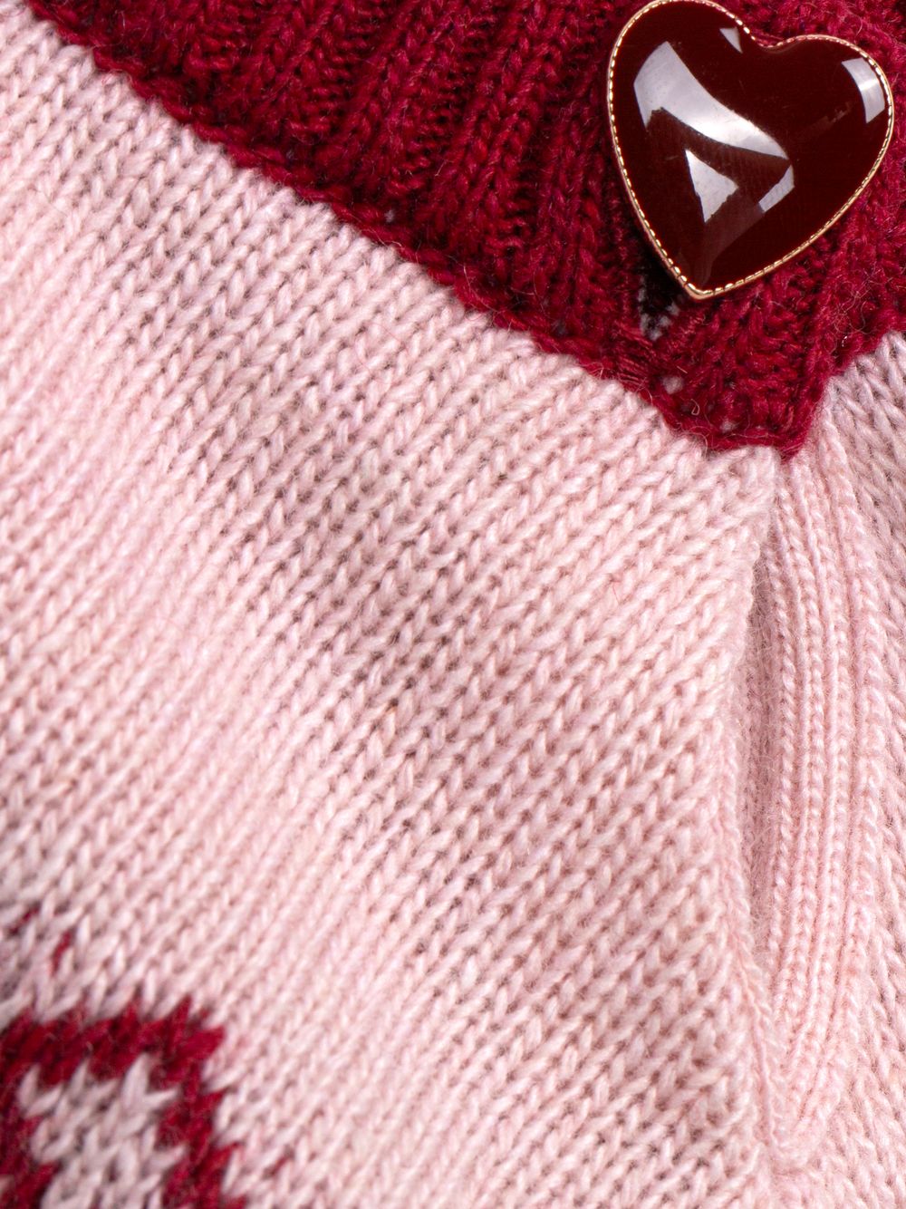 Pale pink sweater with elegant heart pattern
