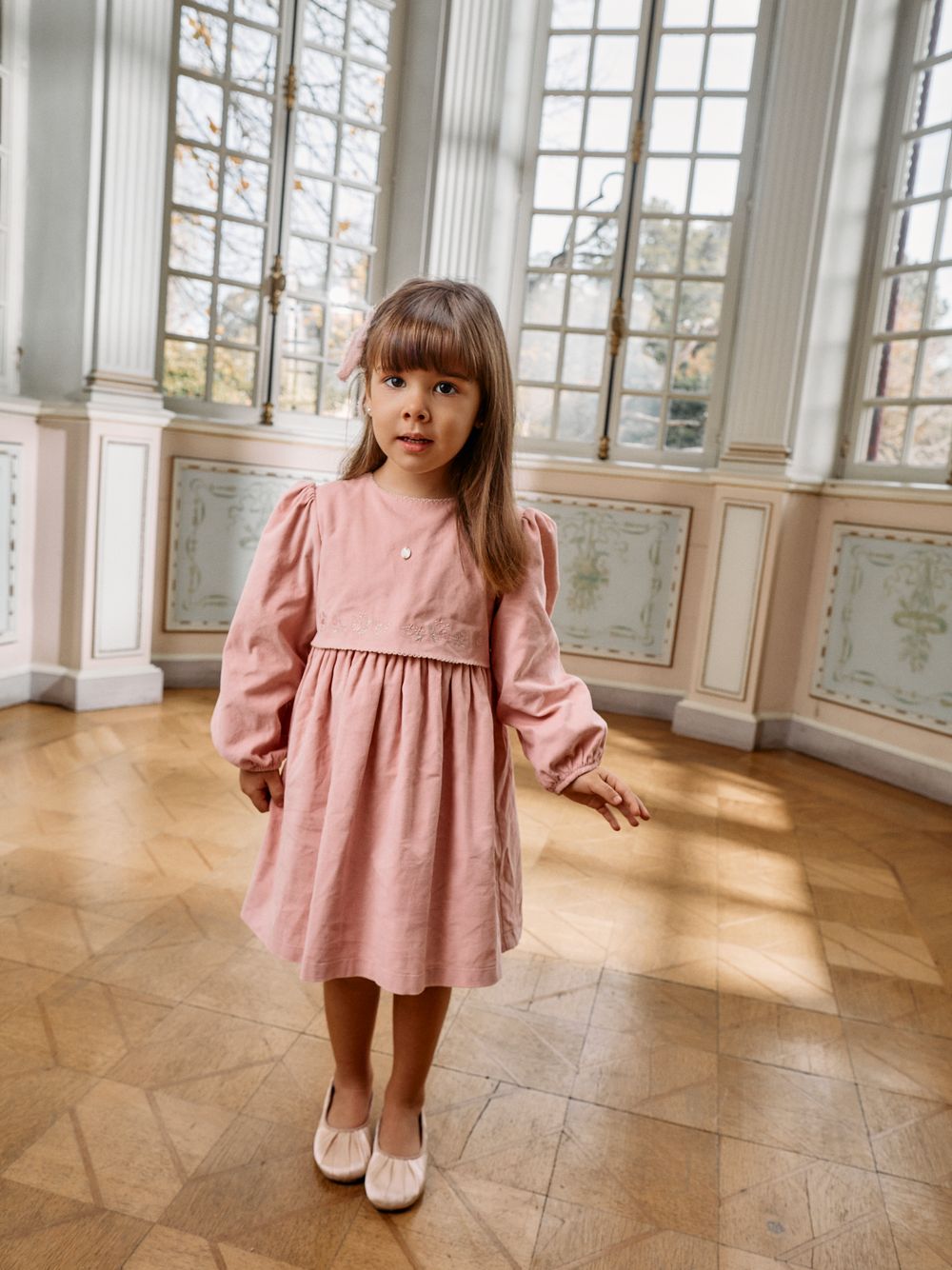 Elegant pale pink dress with floral embroidery