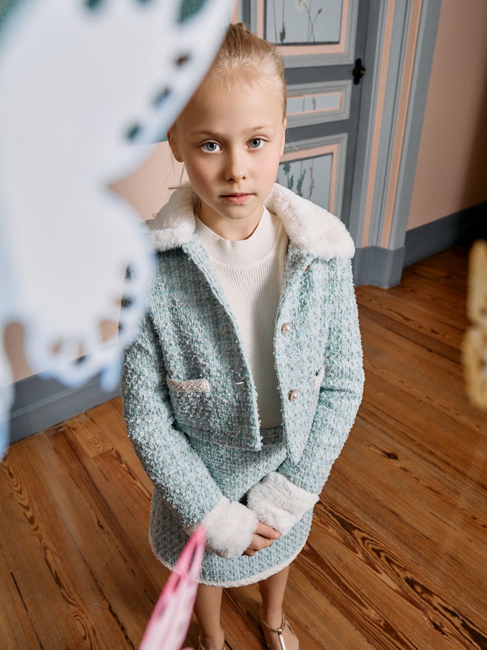 Ecru knit sweater with fur cuffs