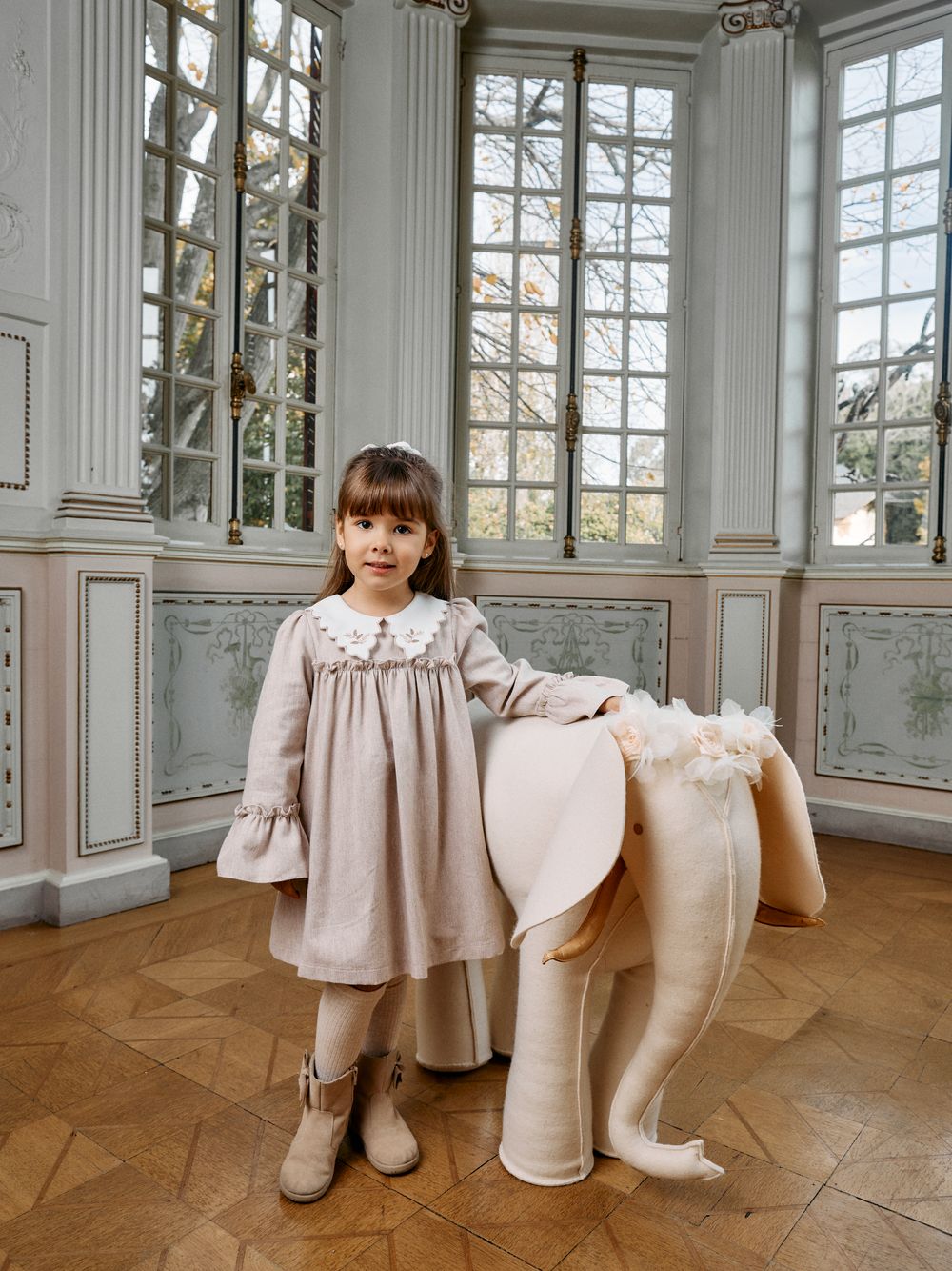 Elegant beige dress with embroidered collar