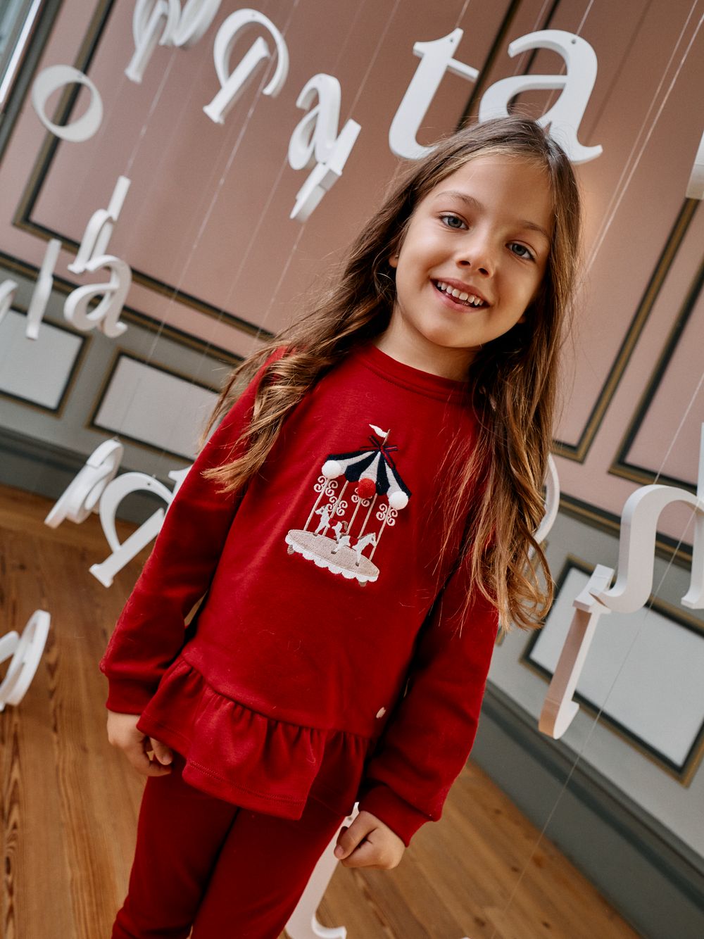 Red set with carousel embroidery on the front