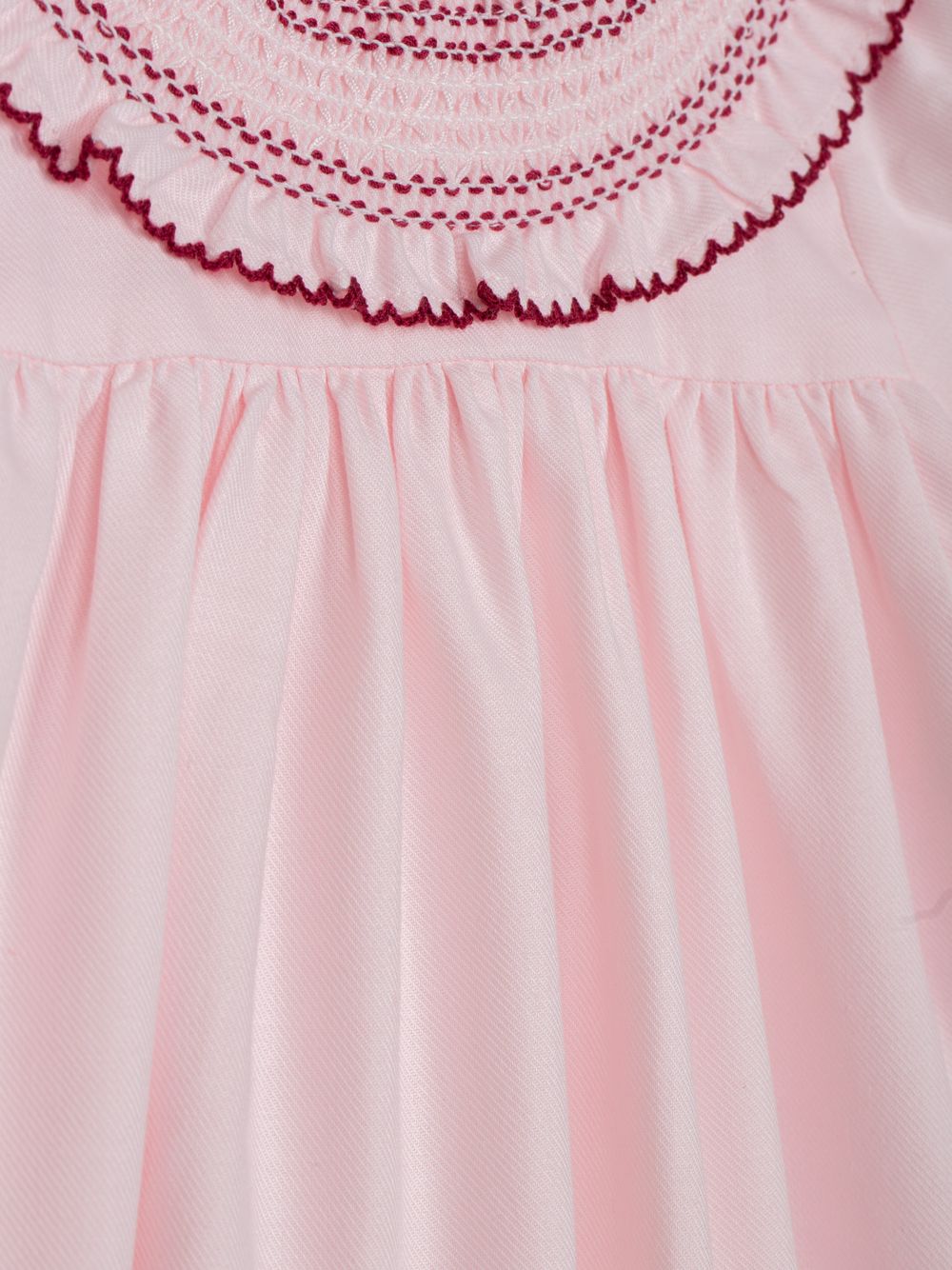 Elegant pink dress with ruffled collar