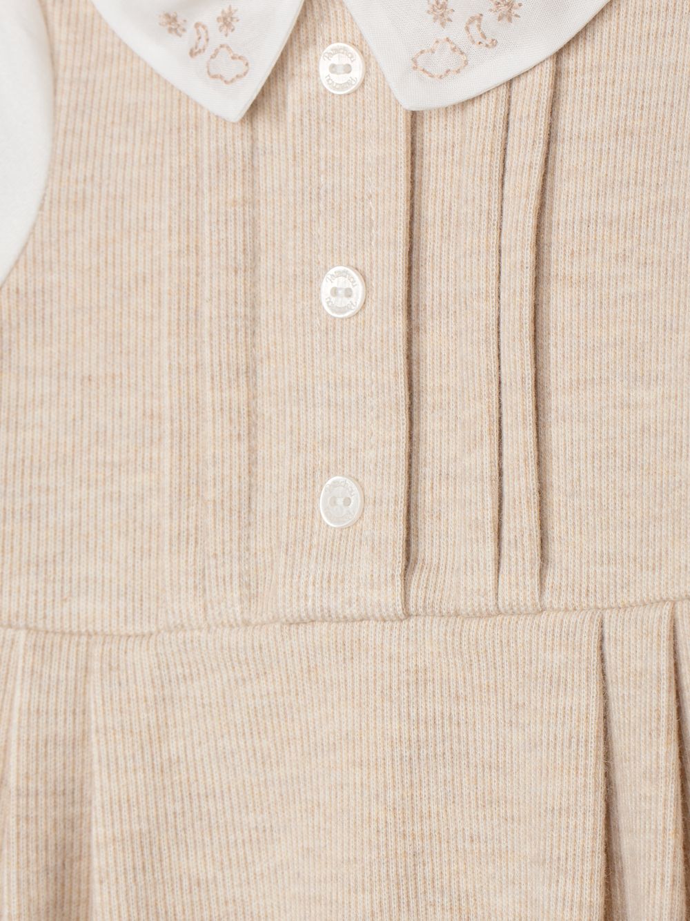 Elegant beige babygrow with embroidered collar