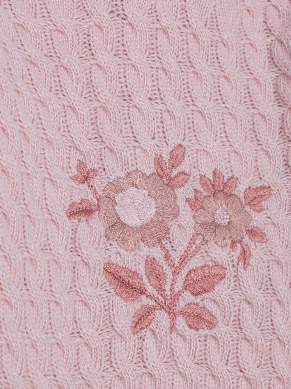 Pale pink knitted sweater with embroidered design