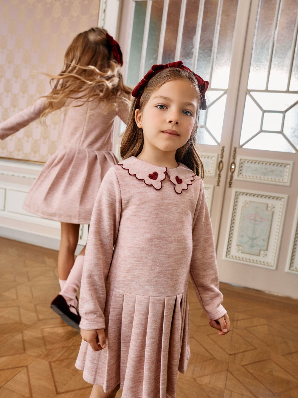 Elegant pink dress with embroidered collar