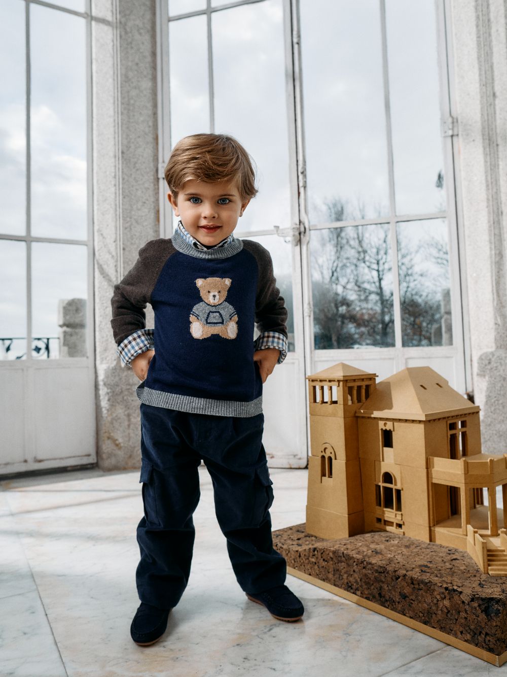 Navy Blue knitted sweater with a teddy bear design on the front