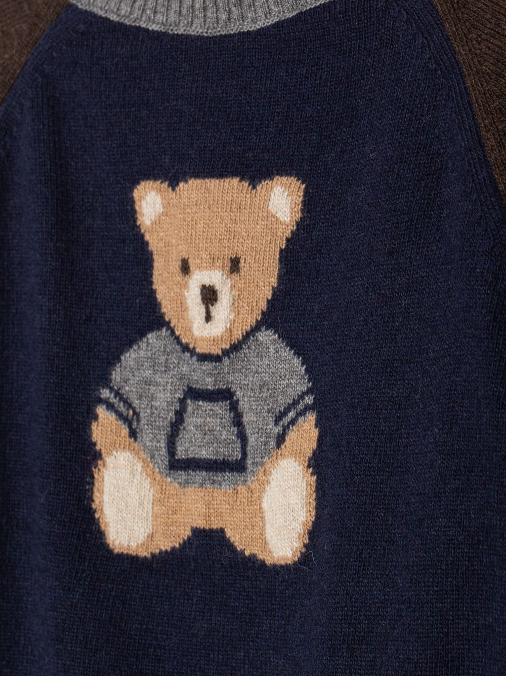 Navy Blue knitted sweater with a teddy bear design on the front