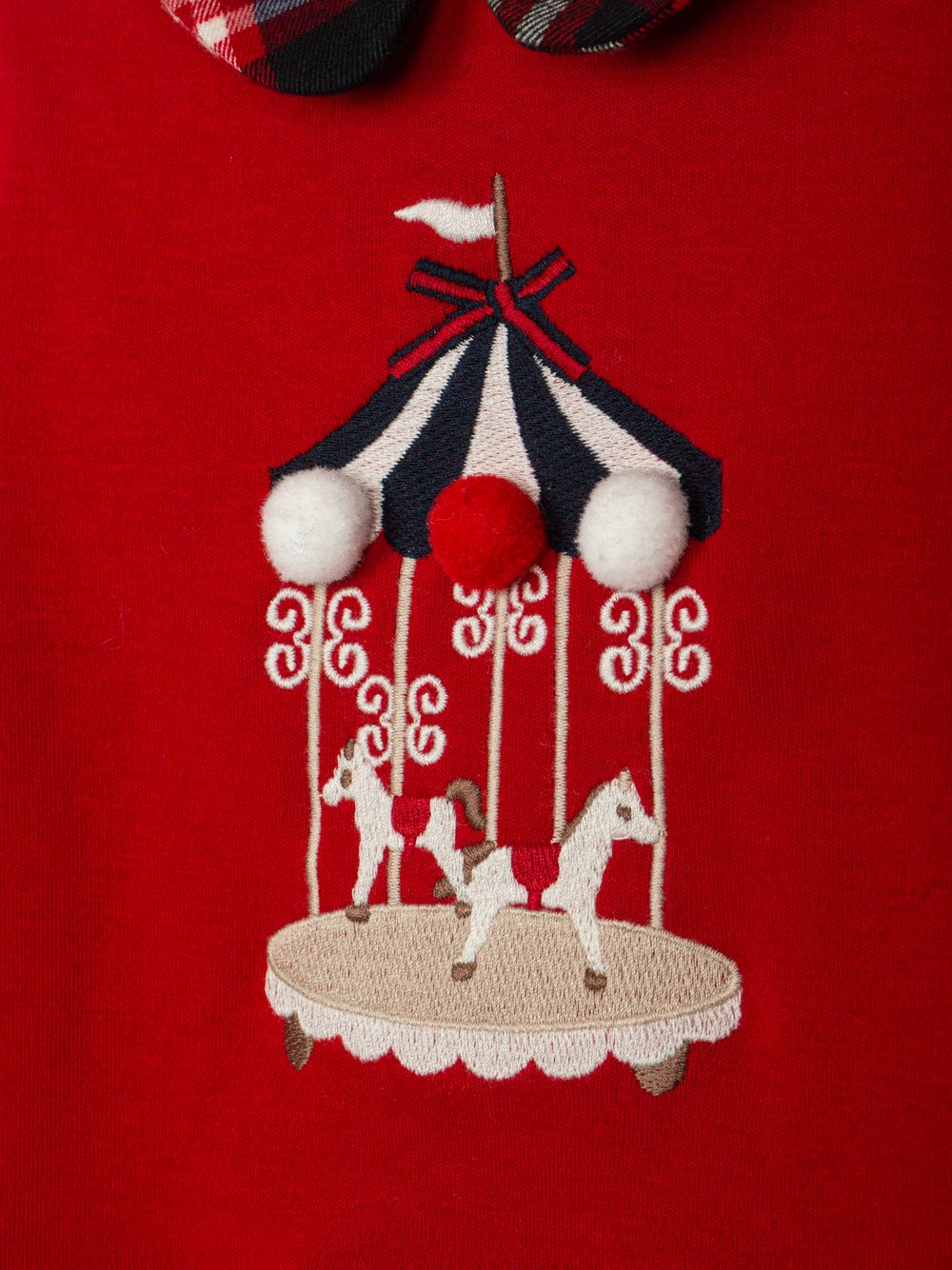 Red dress with front embroidery and tartan skirt