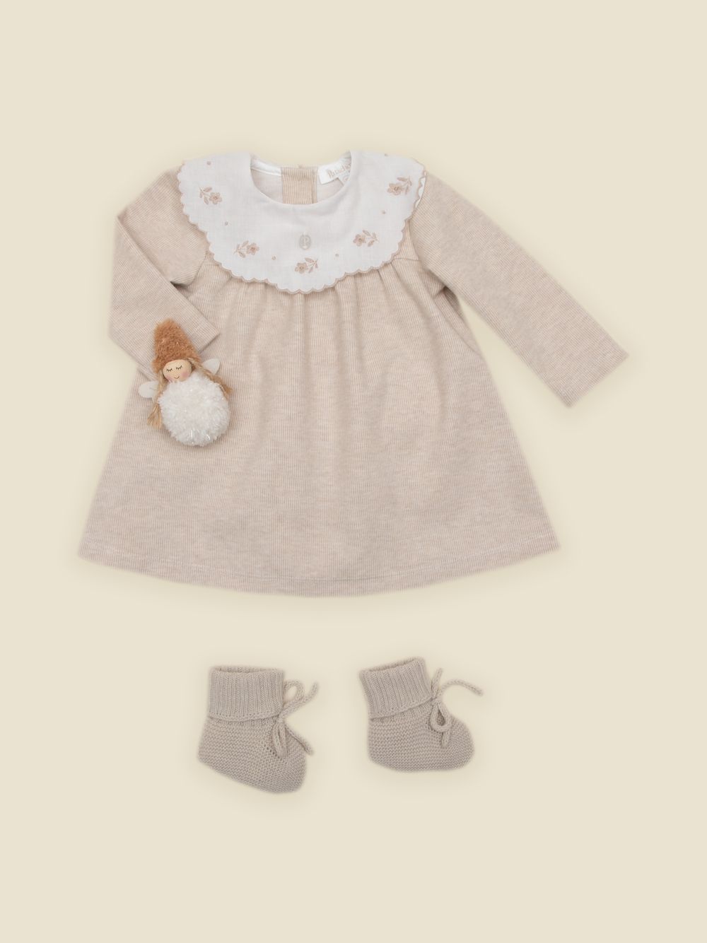 Elegant beige dress with embroidered collar