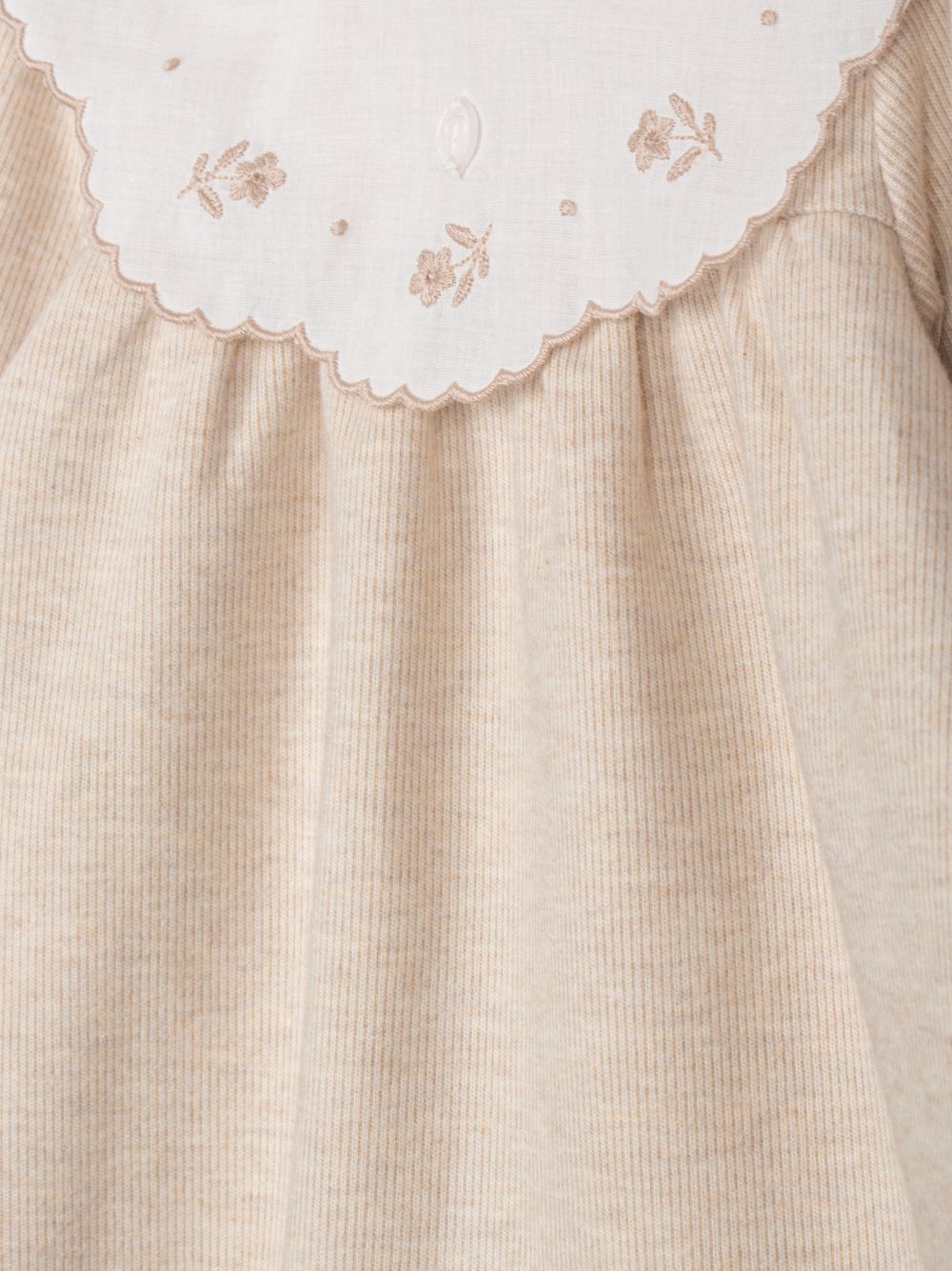 Elegant beige dress with embroidered collar