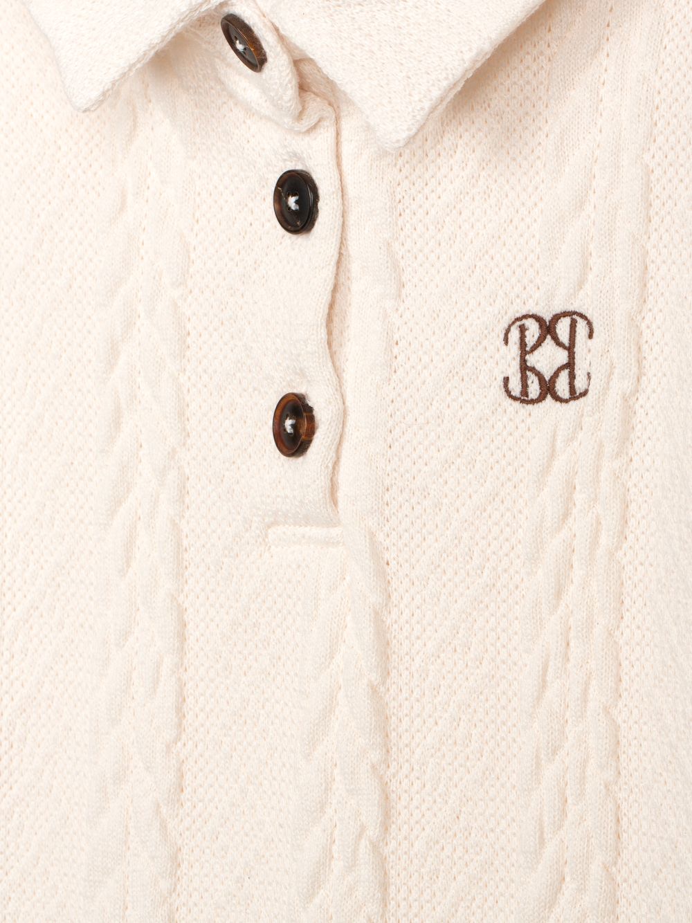 Ecru polo shirt with buttons and elegant embroidery