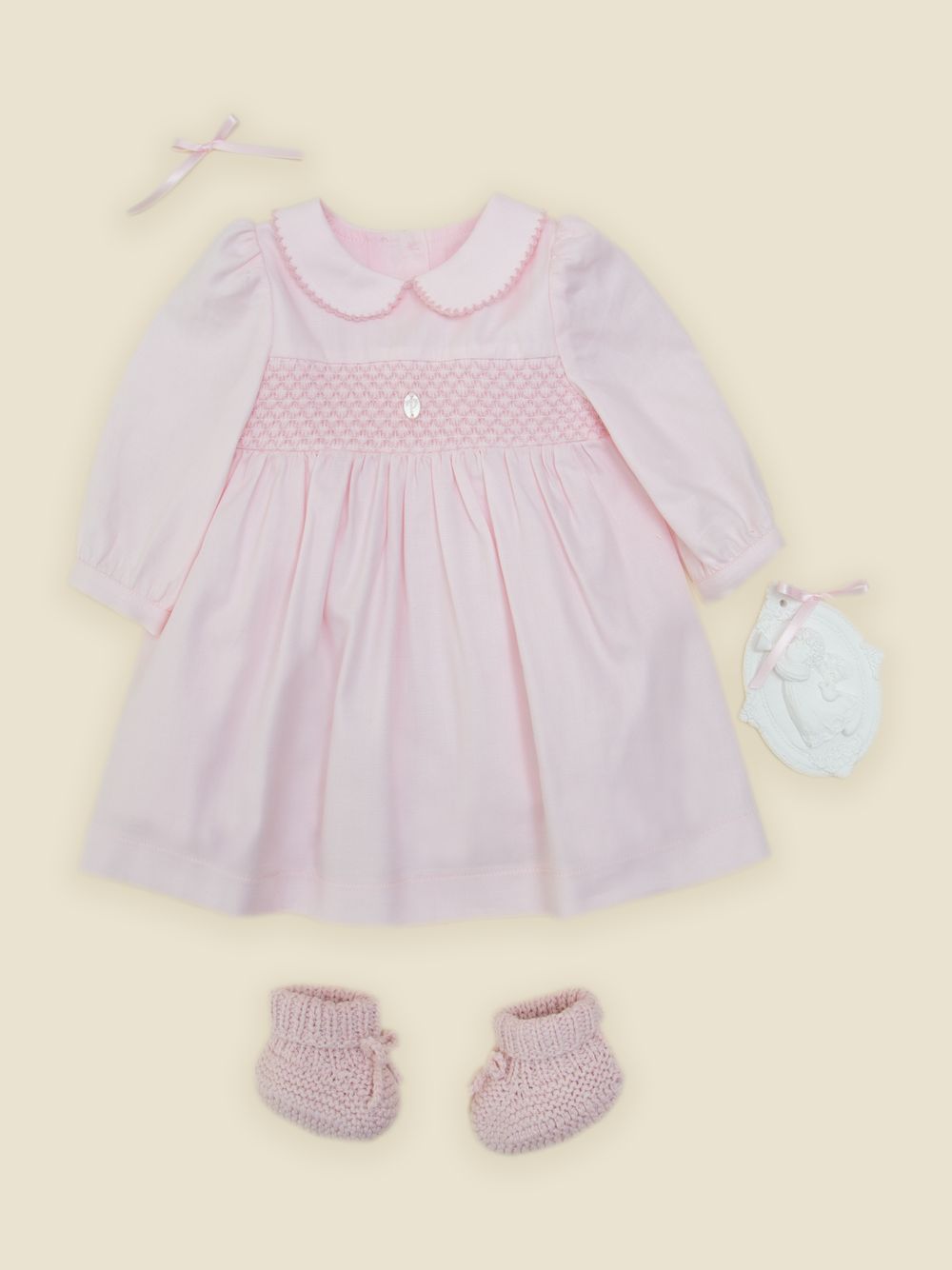 Pink dress with smocked embroidery