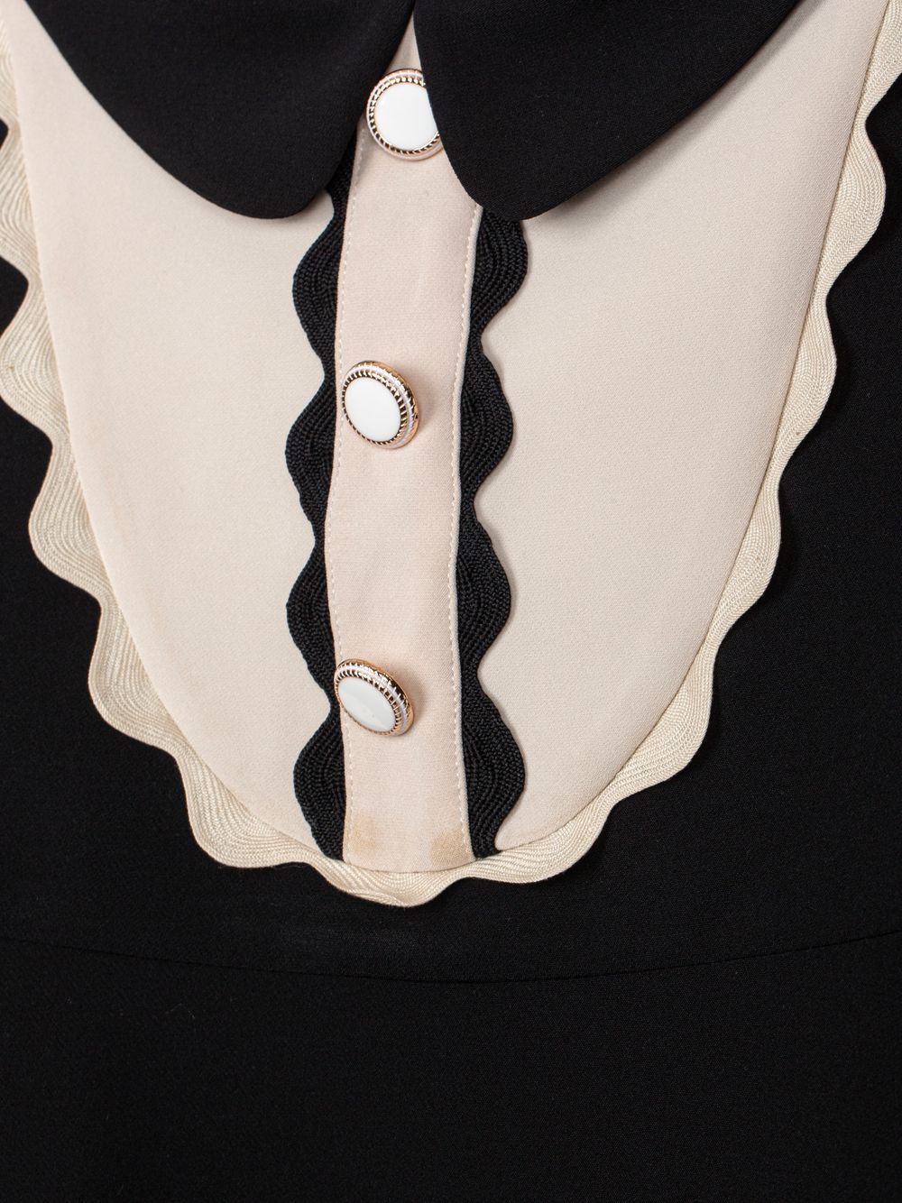 Black dress with elegant detailing at the bust