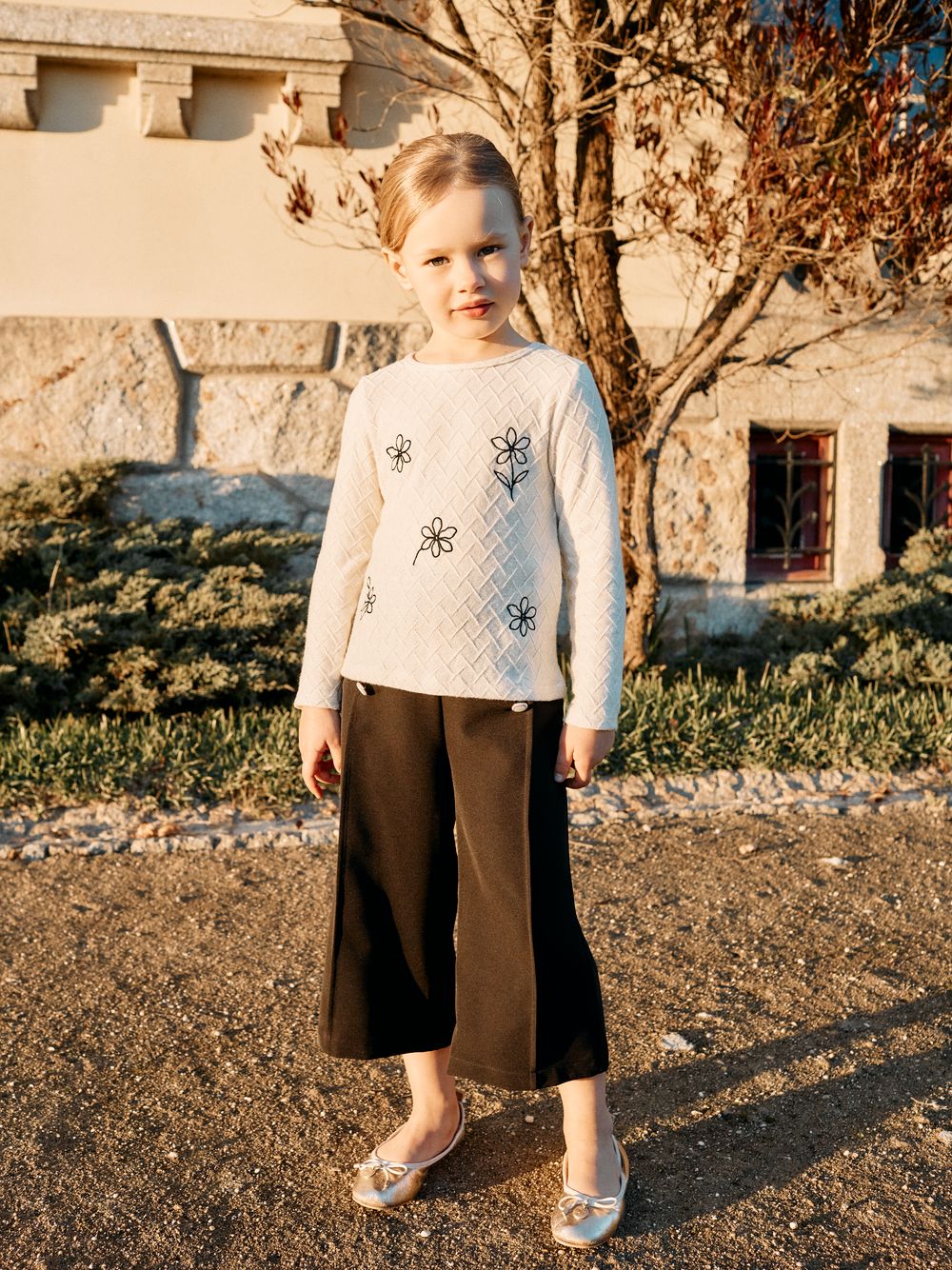 Black trousers with elegant decorative buttons