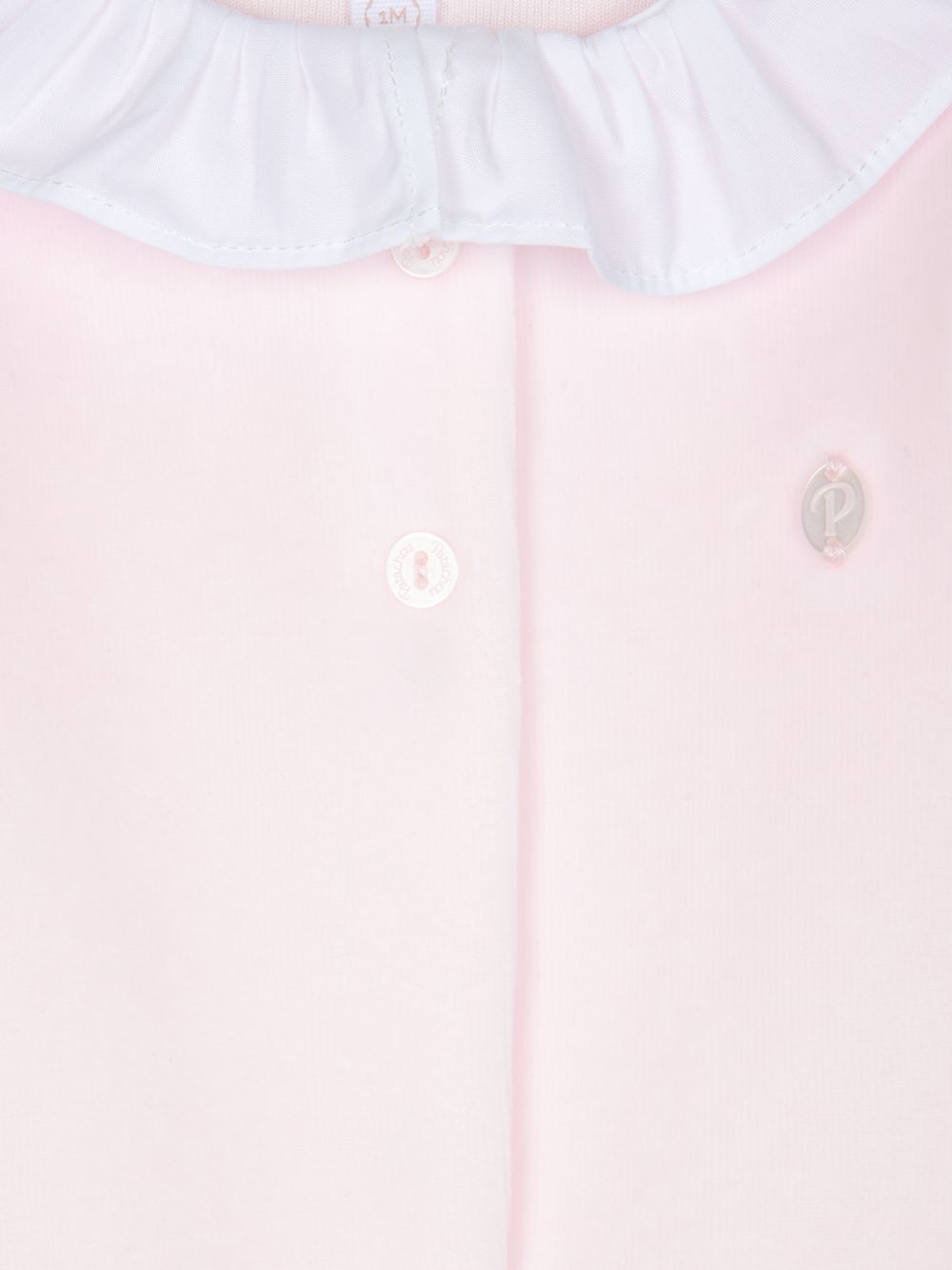 Pink babygrow with a white ruffled collar