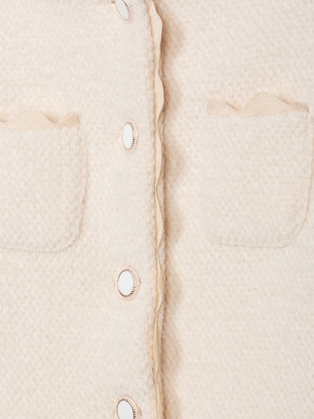 Elegant beige coat with buttons and refined details