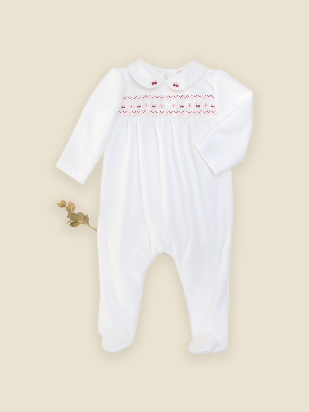 Ecru babygrow with cherry embroidery