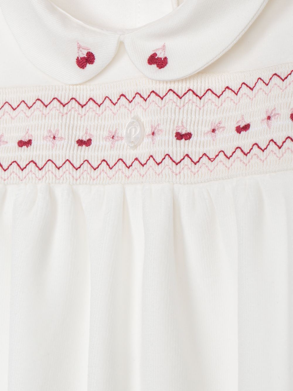 Ecru babygrow with cherry embroidery