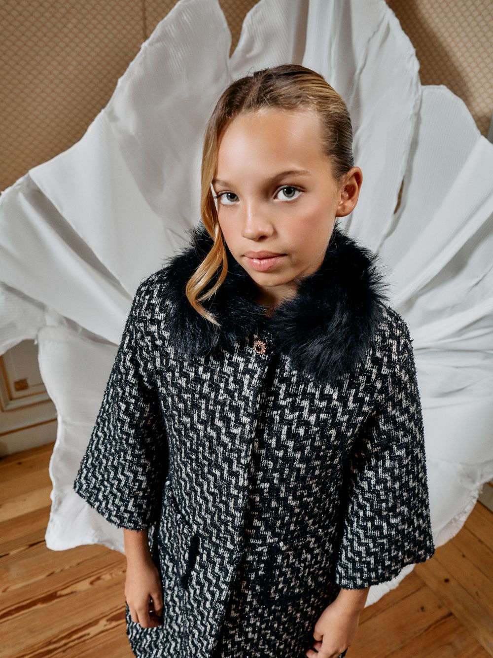 Black tweed coat with a fur collar