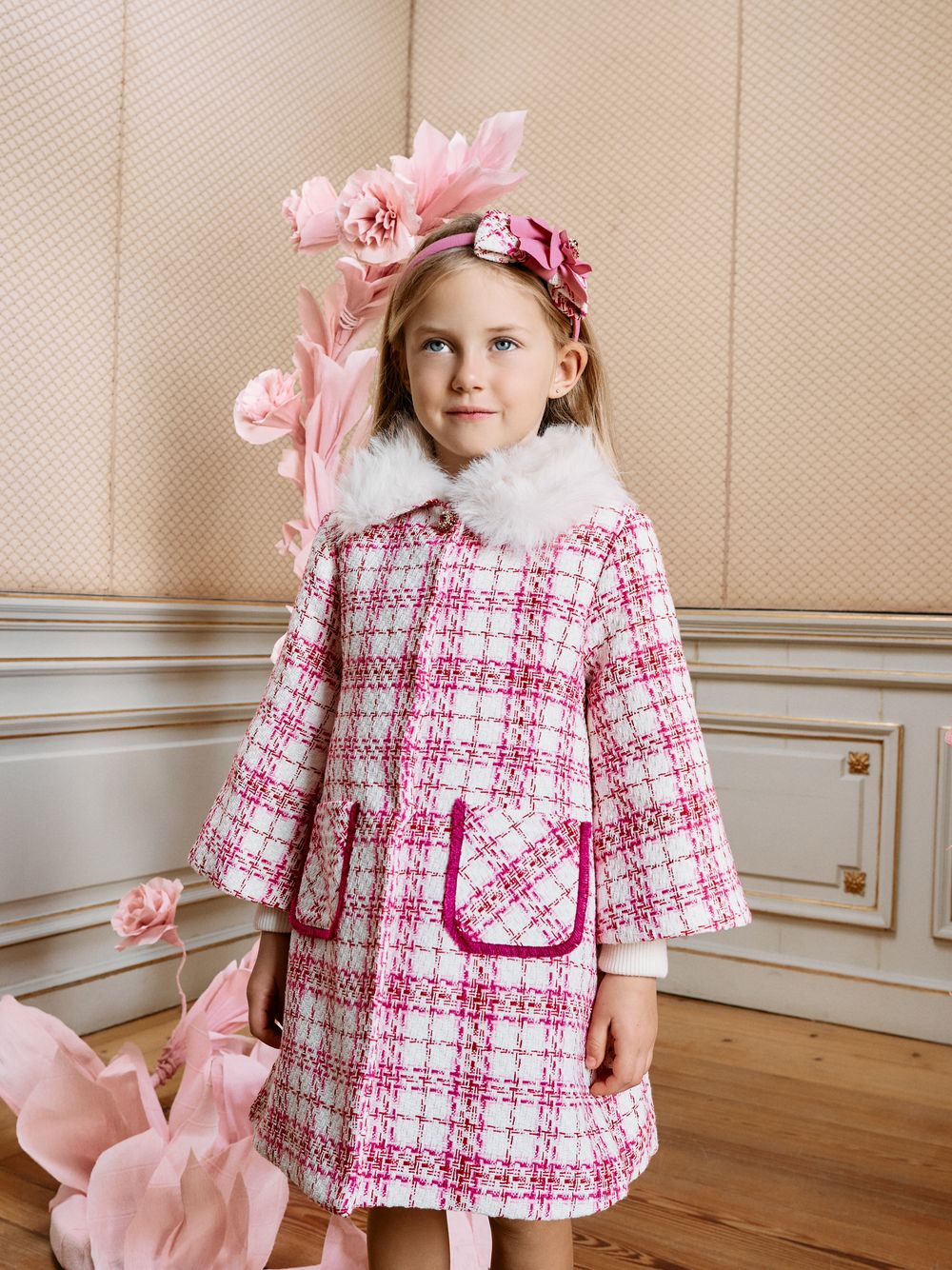 Pink tweed coat with a fur collar