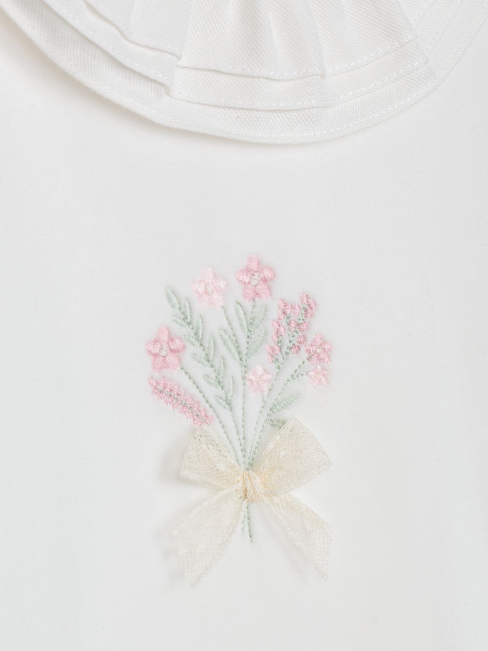 Ecru babygrow with delicate embroidery