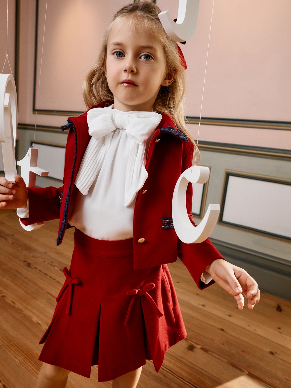 Elegant ecru blouse with bow
