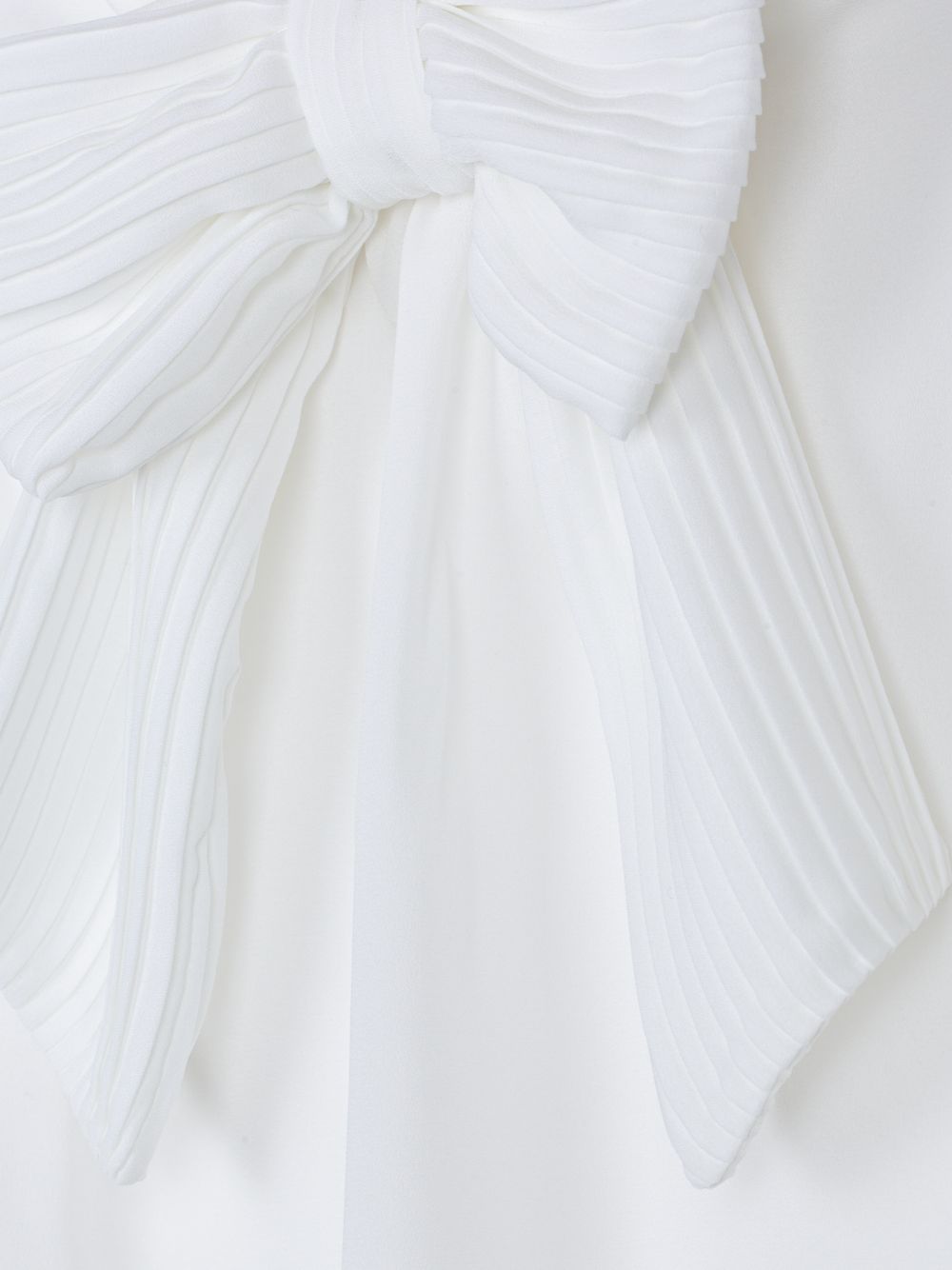 Elegant ecru blouse with bow