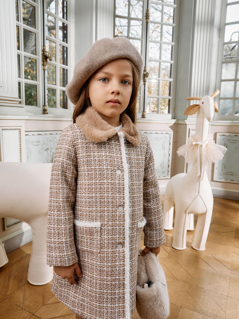 Elegant light brown coat with fur collar